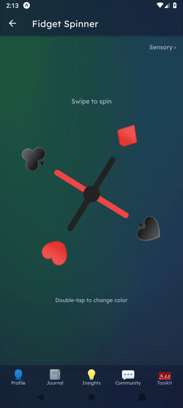 DealtIn Fidget Spinner tool mid-spin, styled with card suits